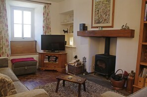 Cosy lounge with woodburning stove at School House in Askrigg, Wensleydale in the Yorkshire Dales
