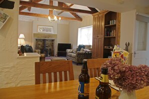 Kitchen with dining area overlooking the lounge at Forge Cottage in Masham
