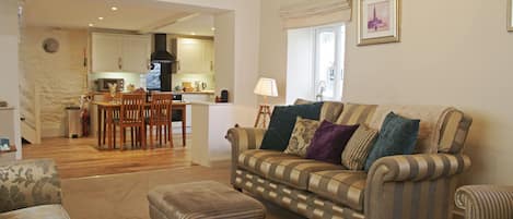 Beautiful and spacious lounge with wood burning stove at Forge Cottage in Masham