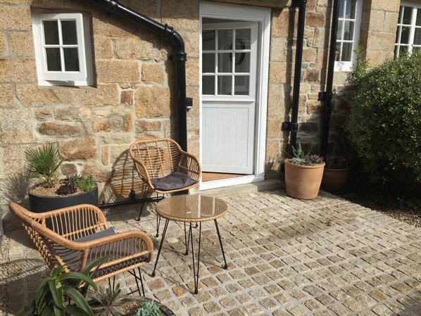 The Garden Room has its own Patio in addition to the shared gardens!