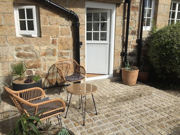 The Garden Room has its own Patio in addition to the shared gardens!