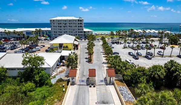 Enter from Front Beach Road through the gated community.