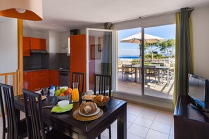 Prepare meals in the kitchenette and enjoy them at the dining table.