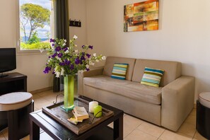 Sink into the plush sofas around the coffee table.