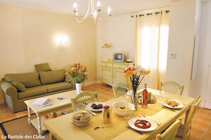 Enjoy meals at the lovely dining table with seating.