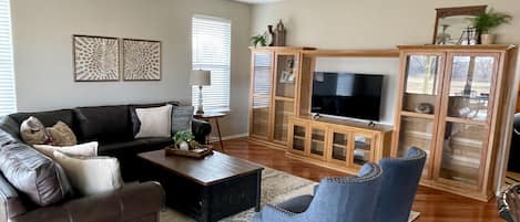 Living Room.  Plenty of seating on the large leather sofa and 2 accent chairs.  