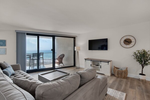 The Sliding Glass Doors to Your Balcony Bring Tons Of  Natural Light Into This Open Concept Living Area.