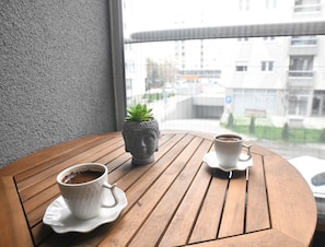 Start your day with a fresh cup of coffee on the balcony.