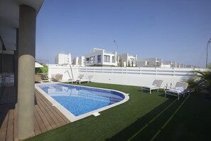 Garden with barbecue, seating area, sun loungers and private pool