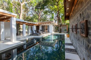 Spacious outdoor lounge and lap pool. (1)