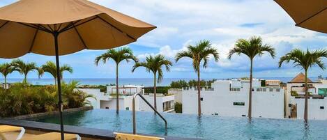 A stunning ocean view rooftop pool on site