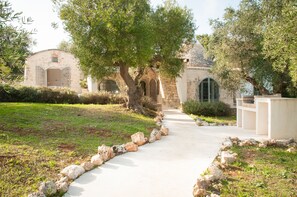 View of the trulli and the bbq from the pool