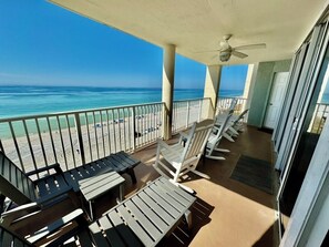 Sliding glass door behind rocking chairs. Front bedroom door behind Adirondacks