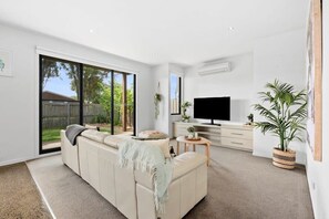With split system heating and cooling units on both floors, the home ensures comfort in any season