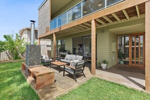 he front deck is a highlight of the home, featuring a gabion rock fire pit that provides warmth and ambience year-round