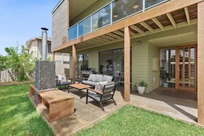 he front deck is a highlight of the home, featuring a gabion rock fire pit that provides warmth and ambience year-round