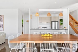 Whether you’re enjoying a casual breakfast at the island bench or family meals at the large dining table, this space is designed to bring people together