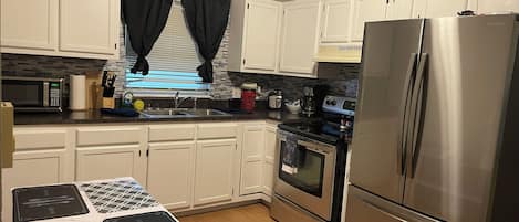 Picture of renovated kitchen with all new appliances. 