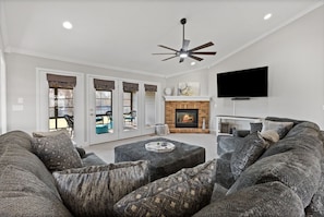 Living room main level. Gas fireplace. 75" smart tv