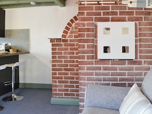 Lovely interior with exposed brickwork | Lucy’s Lodge - Doddick Farm Cottages, Threlkeld, near Keswick