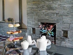 Spacious living room with open fire | Grajo Cottage - Doddick Farm Cottages, Threlkeld, near Keswick