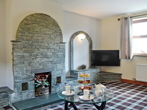 Spacious living room with open fire | Grajo Cottage - Doddick Farm Cottages, Threlkeld, near Keswick