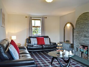 Spacious living room with open fire | Grajo Cottage - Doddick Farm Cottages, Threlkeld, near Keswick