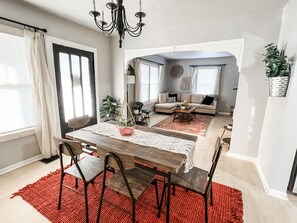 Cozy dining room b/t LR & kitchen! Original black door leads to 3-seasons room!