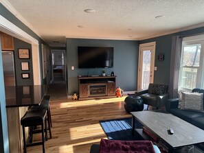 Upper level living room 1 - open floor space plan. Lake view.