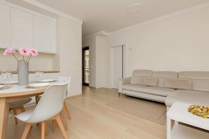 Living room with a comfortable sofa and TV.