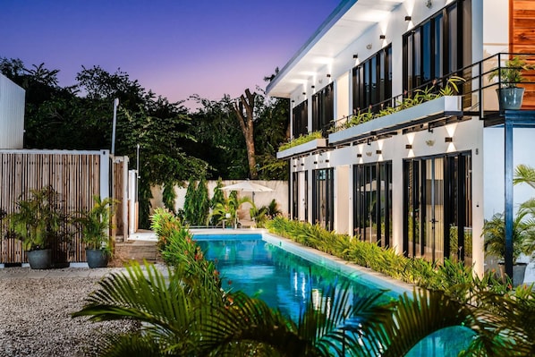 House of Nomad at twilight with pool
