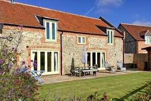 Field Corner, Docking: A handsome traditional brick and flint terraced barn conversion