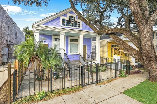 Welcome to your vibrant escape! The charming front entrance sets a cheerful tone for your stay.