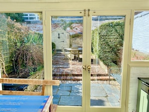 View into the garden from the sun room of Camel Cottage, in Padstow, North Cornwall