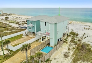 Gulf-front home, with private heated pool, and plenty of parking for your group