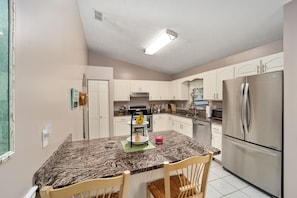 All kitchen amenities and breakfast bar.