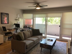 Mid Century Inspired Living Room. Outdoor Patio w/ Natural Lights