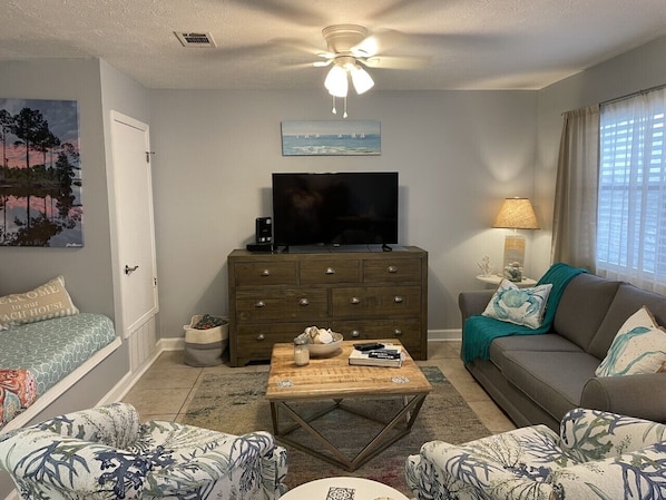 Relax in this beachy atmosphere and ample seating living area 