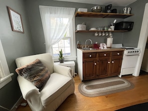 A small kitchenette fully equipped for small-scale cooking.