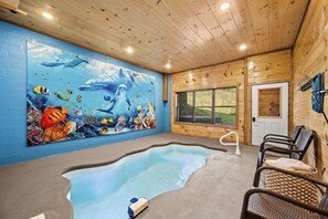 Heated Indoor Pool with seating and towels provided.