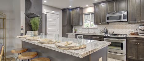 Open concept into the chef's kitchen and plenty of seating for a large group