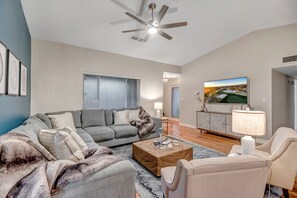 Living Room with Large Sectional and Smart TV with Hulu TV