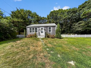 Front of the home with Fenced in yard for small dogs.