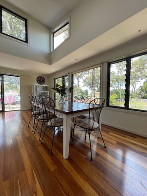 Large timber dining table that can seat up to 10 people