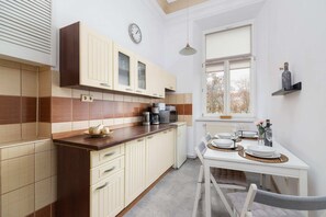 Bright kitchen with cooking utensils. 