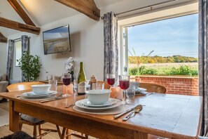 The Old Bunkhouse, Ringstead: Dining table with seating for at least four