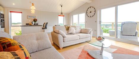 Ingol Lodge, Ingoldisthorpe: An airy open-plan living area with wonderful views