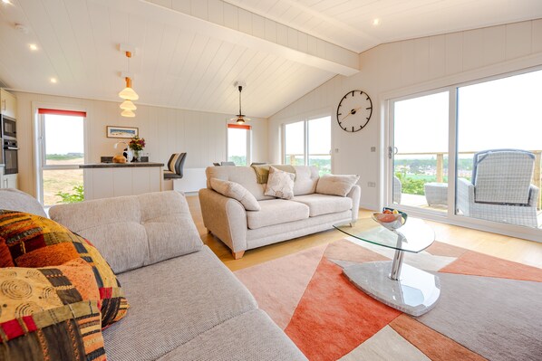 Ingol Lodge, Ingoldisthorpe: An airy open-plan living area with wonderful views