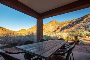 Outdoor dining  under covered patio. Comfortably seats 8. 