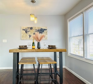 The dining room table is warm and spacious for you to create memorable moments